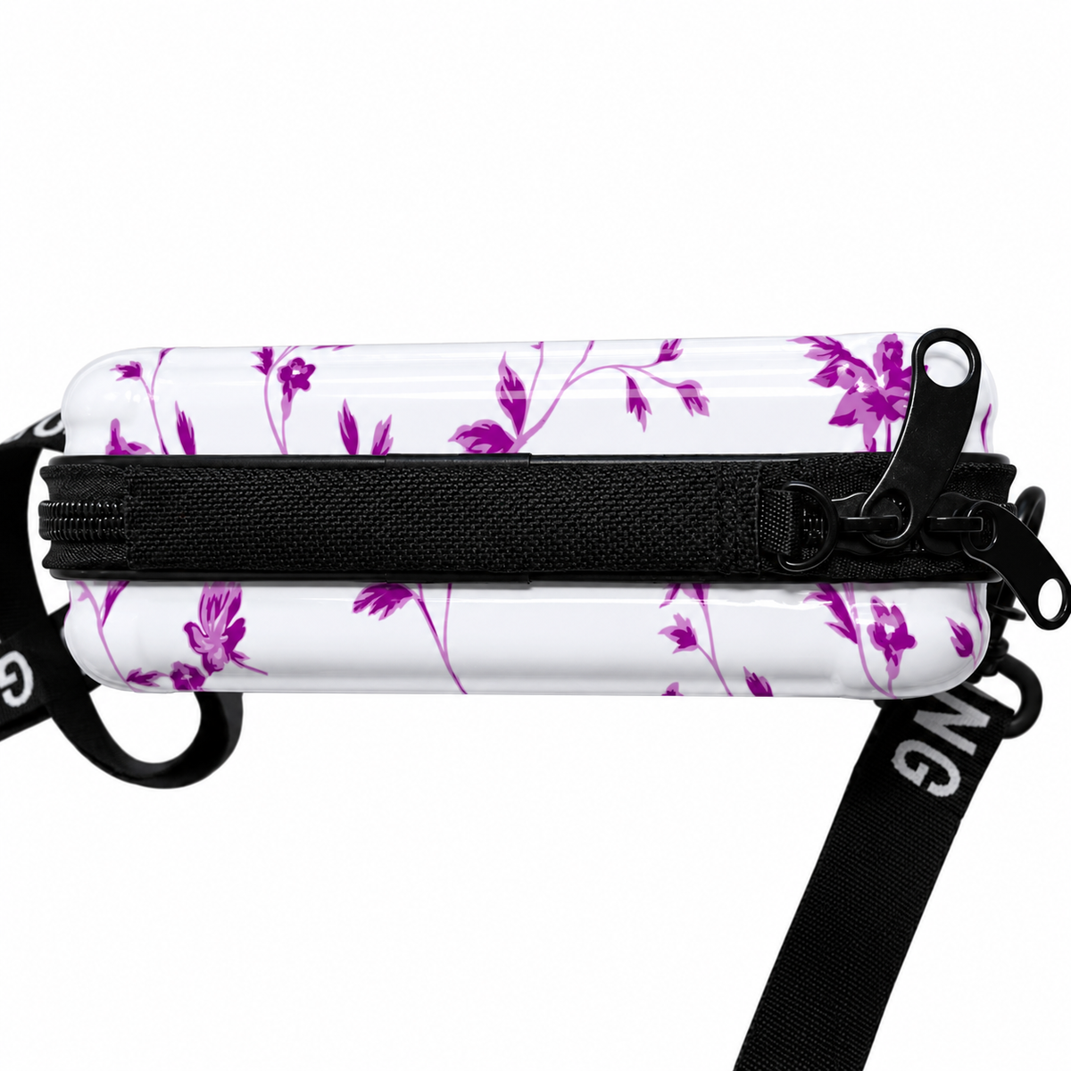 floral hard shell crossbody sling bag with adjustable strap and zip closure